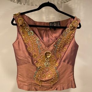Beautiful silk top with heavy beads and details. Never worn with tags. Size 8